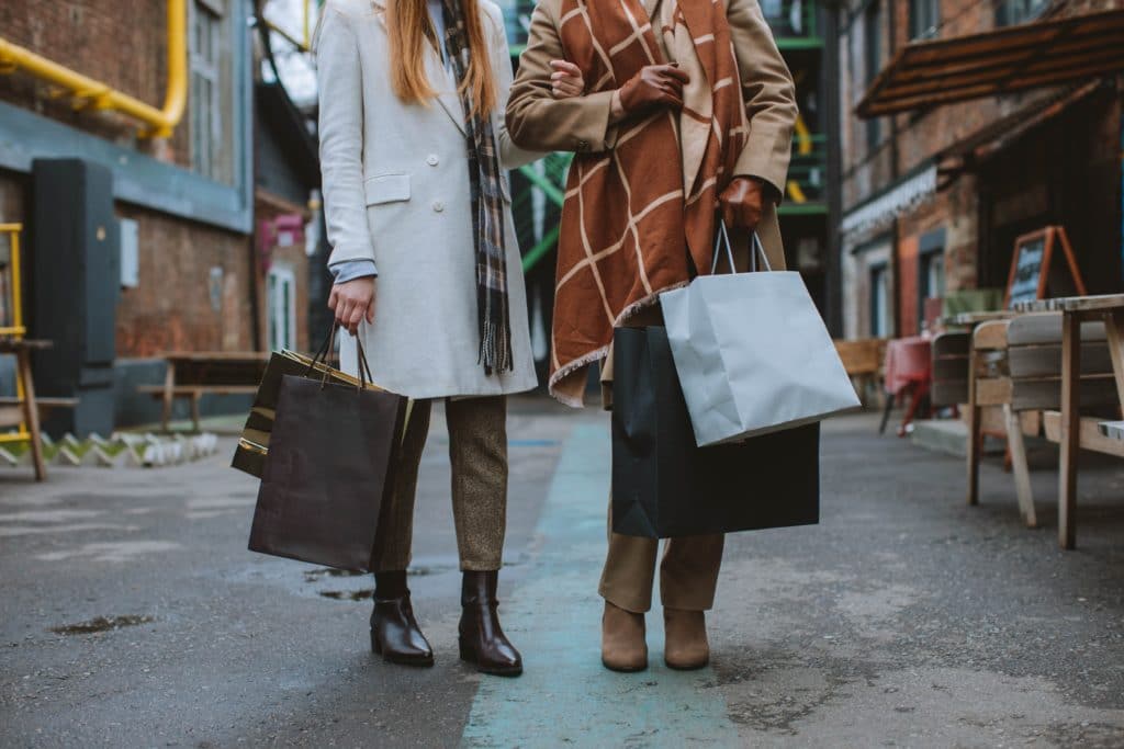 photo of women with shopping bags for Black Friday
