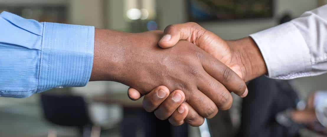 Handshake symbolizing new bank-fintech partnership